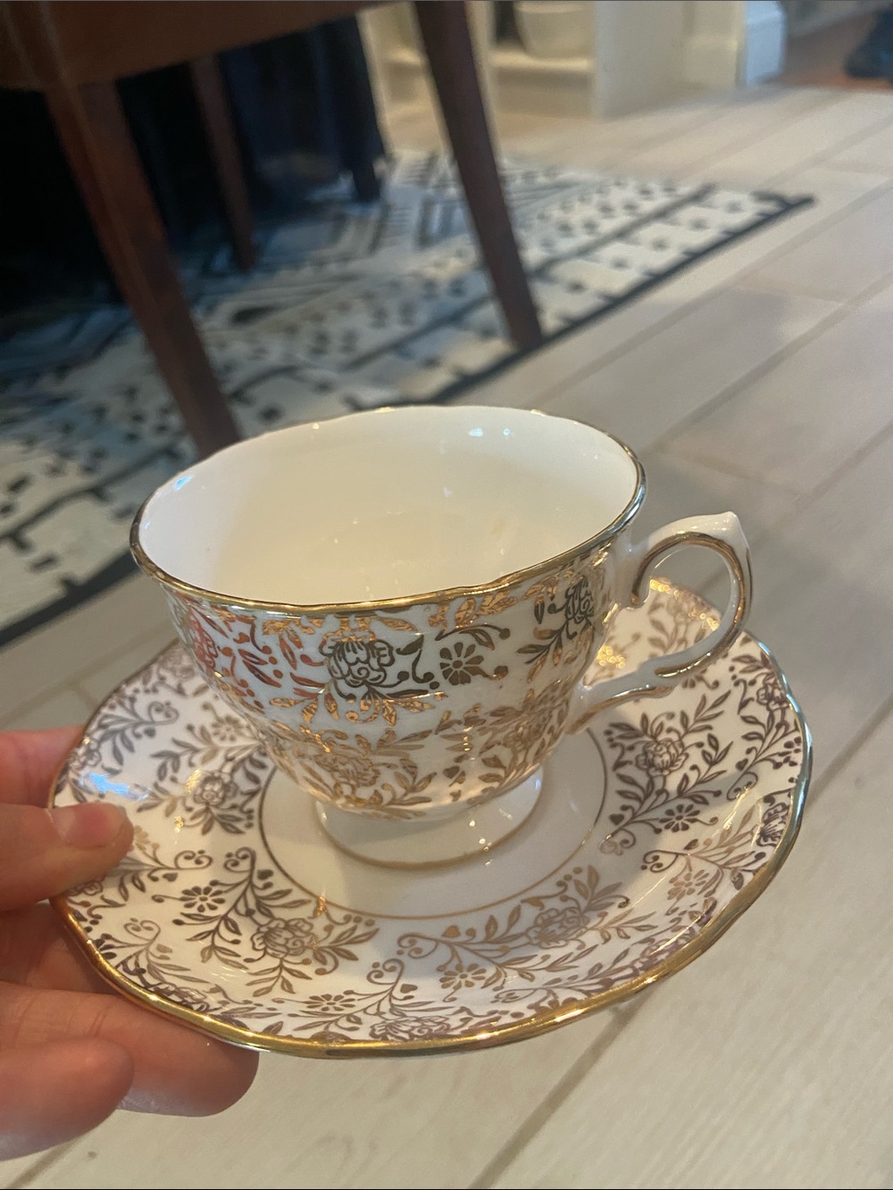 Elegant White and Gold Floral Teacup with Saucer